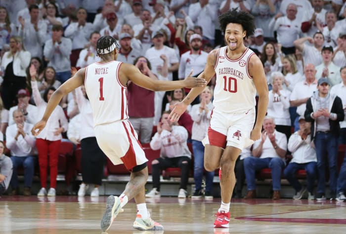 Arkansas Razorbacks guard JD Notae (1) celebrates with forward Jaylin Williams (10) after a score by Williams against the Kentucky Wildcats.